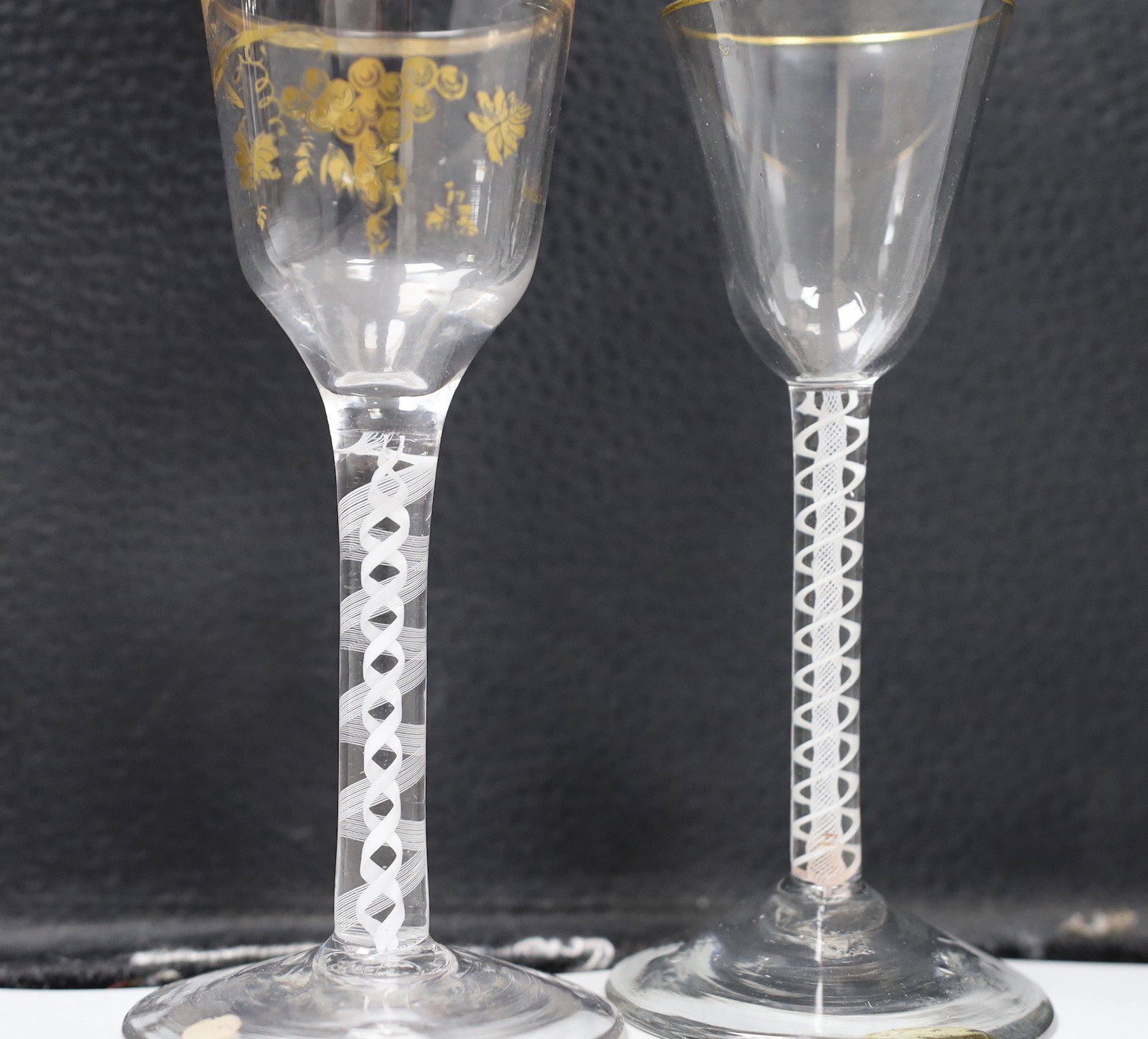 Two George III DSOT stem James Giles gilt decorated wine glasses. Tallest 15cm